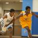 Ypsilanti's Jaylen Johnson dribbles the ball down the court as Skyline's Akeme Okonkwo tries to guard him during their game at Skiyline High school Tuesday, Jan. 15.

Courtney Sacco I AnnArbor.com  